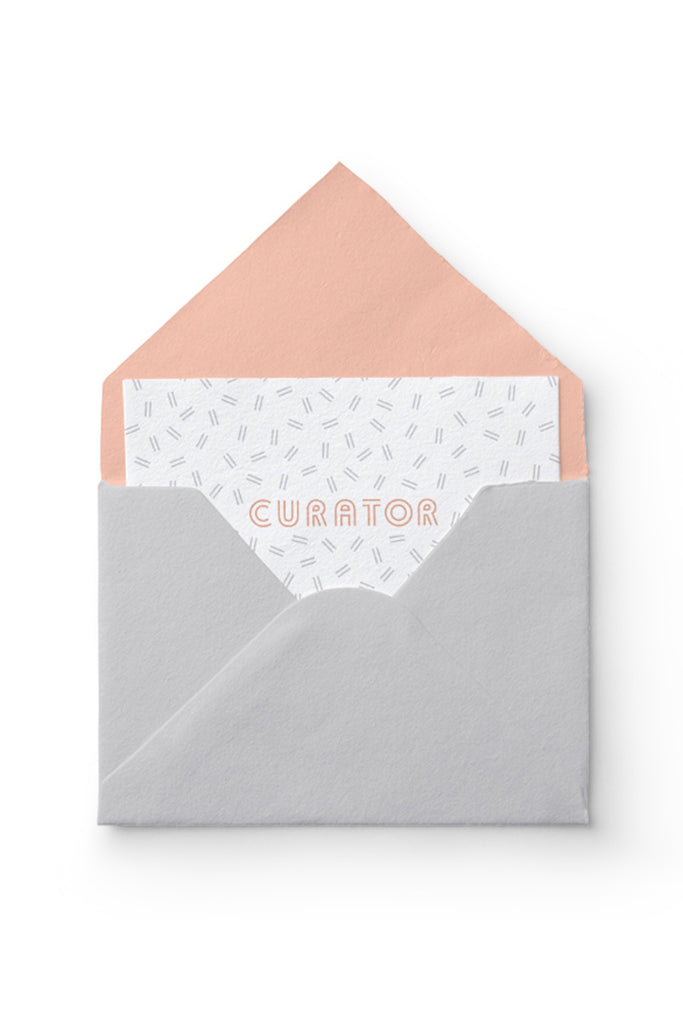 Curator gift card in grey and pink envelope