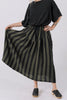 Front view of model wearing Ayana Top in Black and Jessie Stripe Skirt in Mud in front of white background