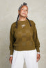 Anya Checkerboard Sweater in Fennel paired with Cadence Pants in White on model in front of white background
