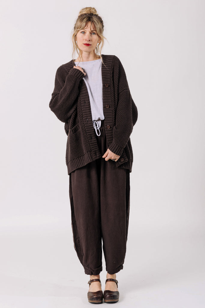 Front view of model wearing Frankie Cardigan in Chocolate, Ayana Top in Mist, Cadence Pant in Chocolate, standing in front of white background