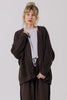 Front view of model wearing Frankie Cardigan in Chocolate, Ayana Top in Mist, and Atlas Pant in Chocolate in front of white background