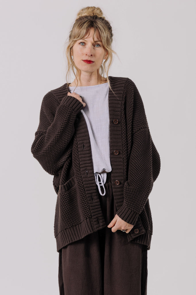 Front view of model wearing Frankie Cardigan in Chocolate, Ayana Top in Mist, and Atlas Pant in Chocolate in front of white background