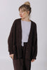Front view of model wearing Frankie Cardigan in Chocolate, Ayana Top in Mist, and Atlas Pant in Chocolate in front of white background