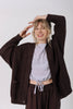 Front view of model wearing Frankie Cardigan in Chocolate, Ayana Top in Mist, and Atlas Pant in Chocolate in front of white background