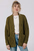 Front view of model wearing Frankie Cardigan in Fennel, Ayana Top in White, and light wash jeans, in front of white background