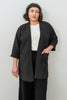 Front view of model wearing Jules Cardigan in Black, Ayana Top in White, and Atlas Pant in Black in front of white background