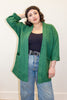Jules Cardigan in Fern on model in front of white wall
