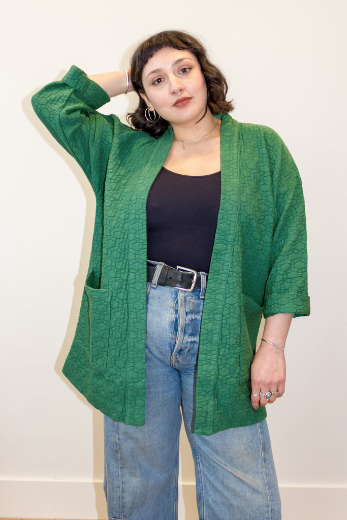 Jules Cardigan in Fern on model in front of white wall
