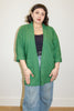 Jules Cardigan in Fern on model in front of white wall