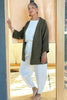 Front view of model wearing Jules Cardigan in Mud, Ayana Top in White, and Cadence Pant in Natural, standing in wooden doorway