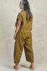Back view of model wearing Jones Top in Fennel and Larkin Pant in Fennel, in front of white background