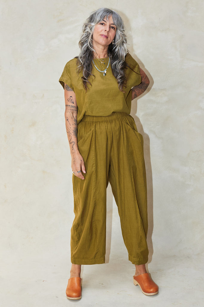 Model wearing Jones Top in Fennel and Larkin Pant in Fennel against white background