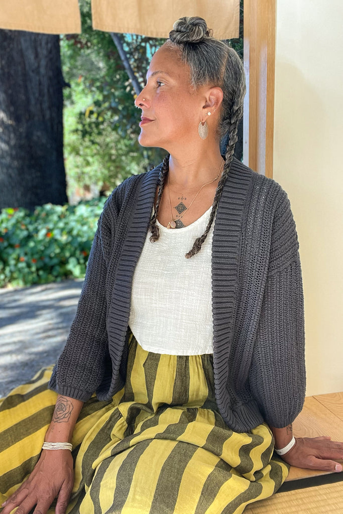 Maeva Cardigan in Chacoal paired with Jessie Skirt in Dijon on sitting model