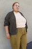 Maeva Cardigan in Charcoal on model standing in front of grey wall