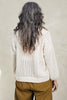 Back view of Maeva Cardigan in Biscuit on model in front of white background