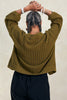 Back view of model wearing Maeva Cardigan in Fennel on white background