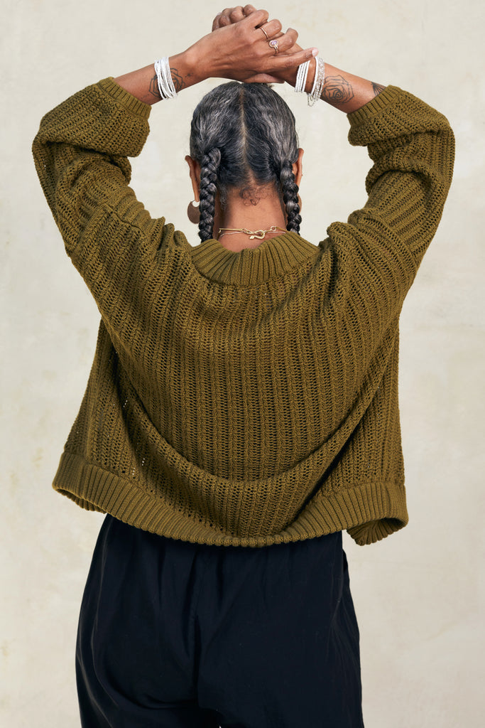 Back view of model wearing Maeva Cardigan in Fennel on white background