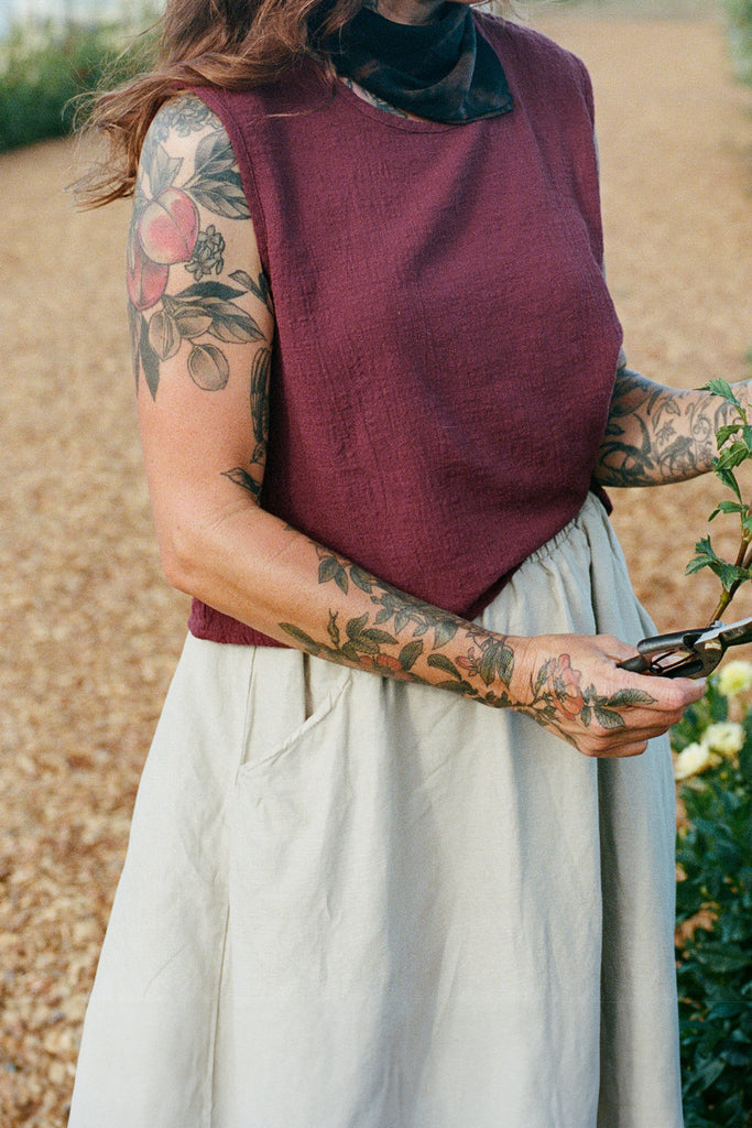 Minnie Tank in Burgundy on model in nature setting