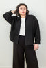 Front view of model wearing Oona Cardigan in Black, Ayana Top in White, and Atlas Pant in Black in front of white background