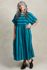Perry Stripe Dress in Ocean on model standing in front of white background