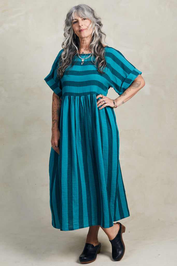 Perry Stripe Dress in Ocean on model standing in front of white background