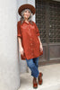 Long Poet Blouse in Brick on model in front of stone building