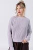 Front view of model wearing Sonnie Sweater in Mist and Atlas Pant in Chocolate in front of white background