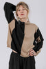 Front view of model wearing Sybil Vertical Stripe Sweater in Black/Tan and Atlas Pant in Black, in front of white background