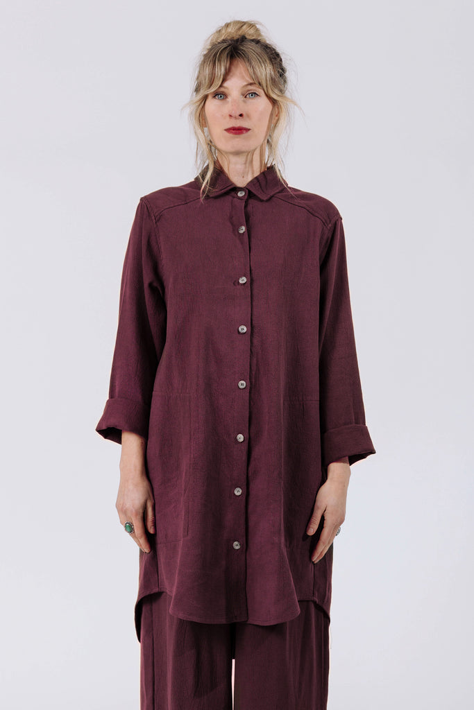 Front view of model wearing Workshirt in Burgundy and Cadence Pant in Burgundy, standing in front of white background