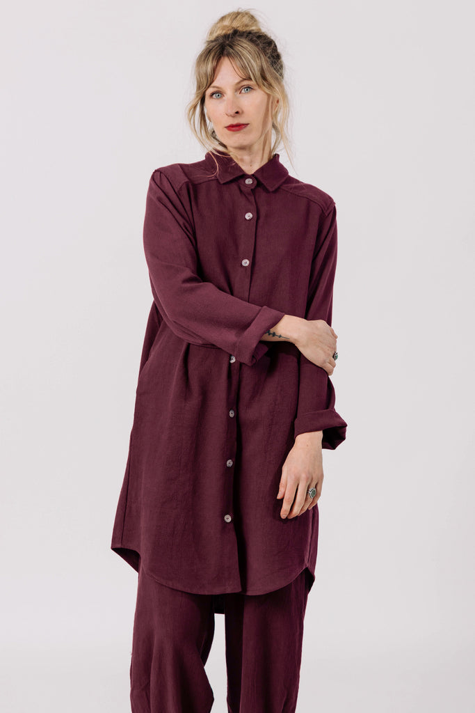 Front view of model wearing Workshirt in Burgundy and Cadence Pant in Burgundy, standing in front of white background