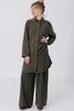 Front view of model wearing Workshirt and Atlas Pant, both in Mud, standing with hand on hip in front of white background