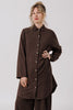 Model wearing Workshirt and Cadence Pants in Chocolate, standing with one hand on hip in front of white background