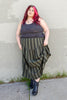 Model wearing Zoe Tank in Charcoal and Jessie Skirt in Mud/Black Stripe in front of light green wall