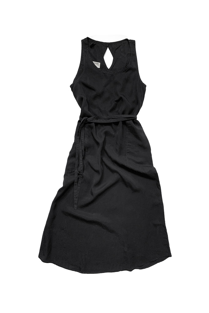 Long black sleeveless dress with tie waist against white background