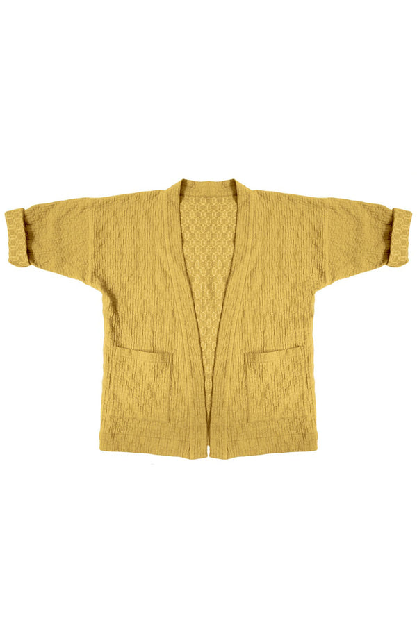 yellow quilted jacket with patch pockets on white background