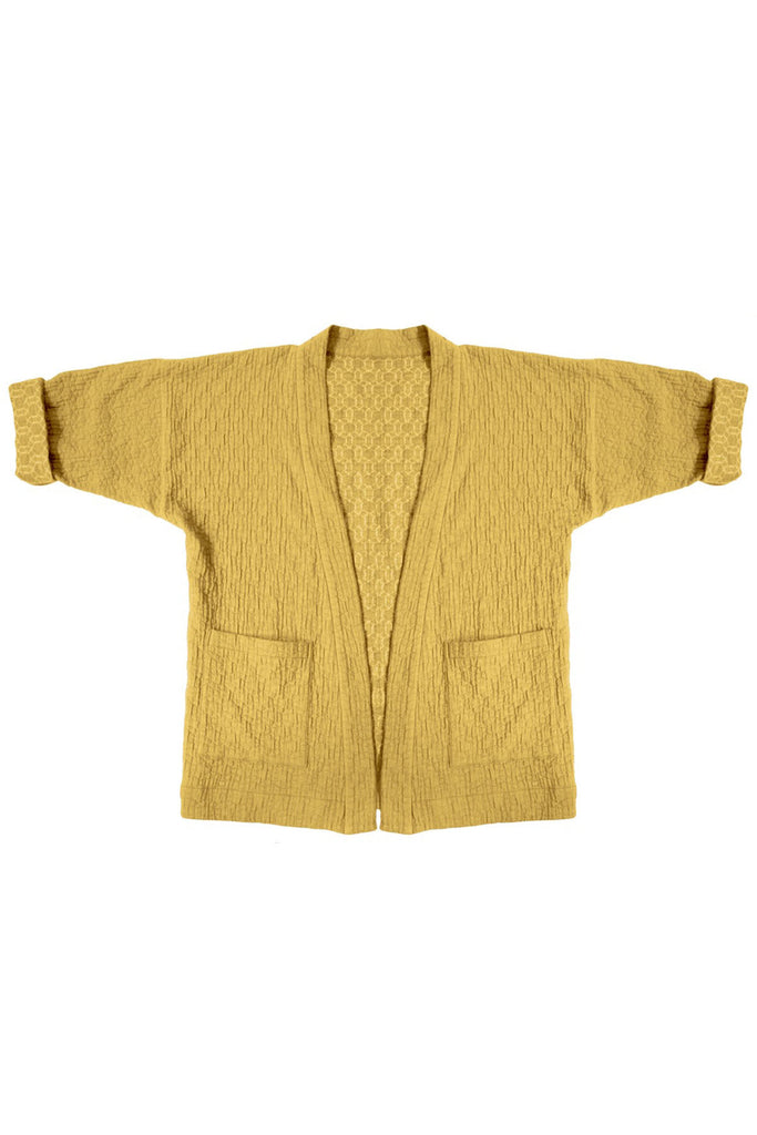 yellow quilted jacket with patch pockets on white background
