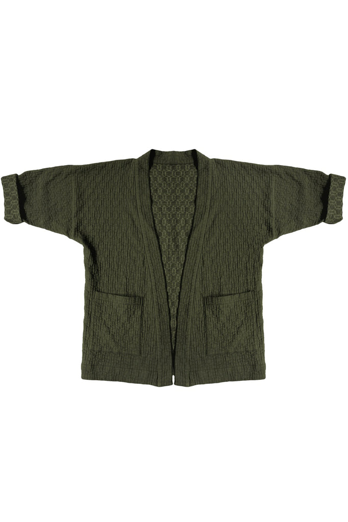 forest green quilted jacket with front patch pockets against white background
